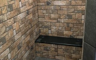 Stone shower with bench