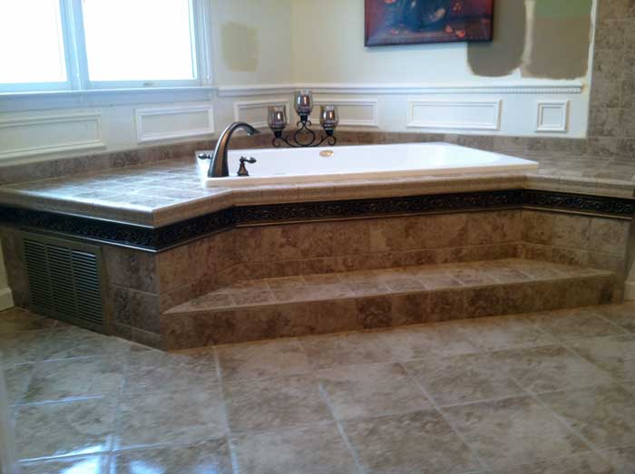 Tiled step-up bathtub