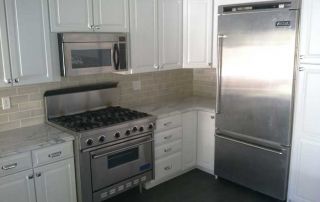 Stainless steel appliances in a remodeled kitchen